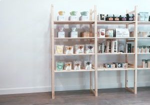 brown wooden shelf with bottles and jars